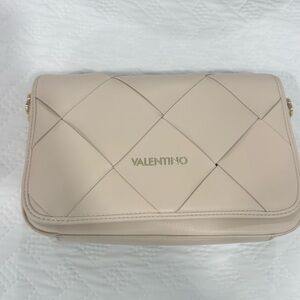 Valentino Spa bag, never been used. Pet free home. Dust Bag, tag and straps inc.